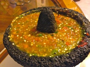 This salsa molcajeteada combines pan roasted tomatoes, garlic, and peppers to make a spicy and hearty salsa. They are pureed in a molcajete.
