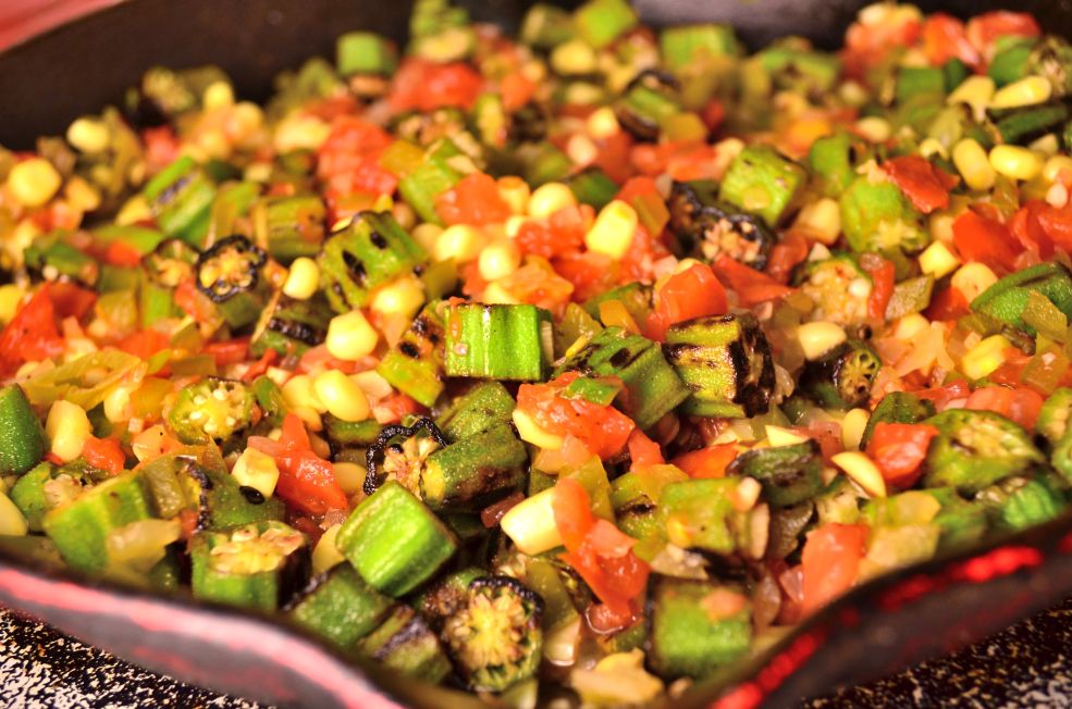 These creamy southern vegan grits are topped with a spicy charred okra, tomato, onion, garlic, and corn sauté. No dairy needed!