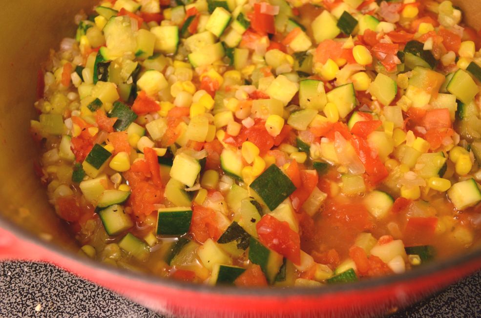 Vegan chile relleno vegetable filling in a cast iron dutch oven.