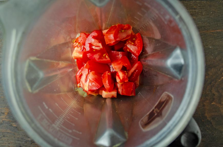 Top view of diced tomatoes in a blender jar.