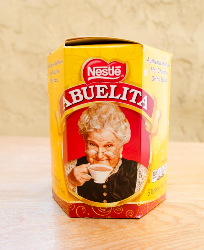 A box of Nestle Abuelita drinking chocolate on a wood surface.