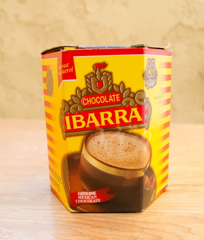 A box of Ibarra drinking chocolate on a wood surface.