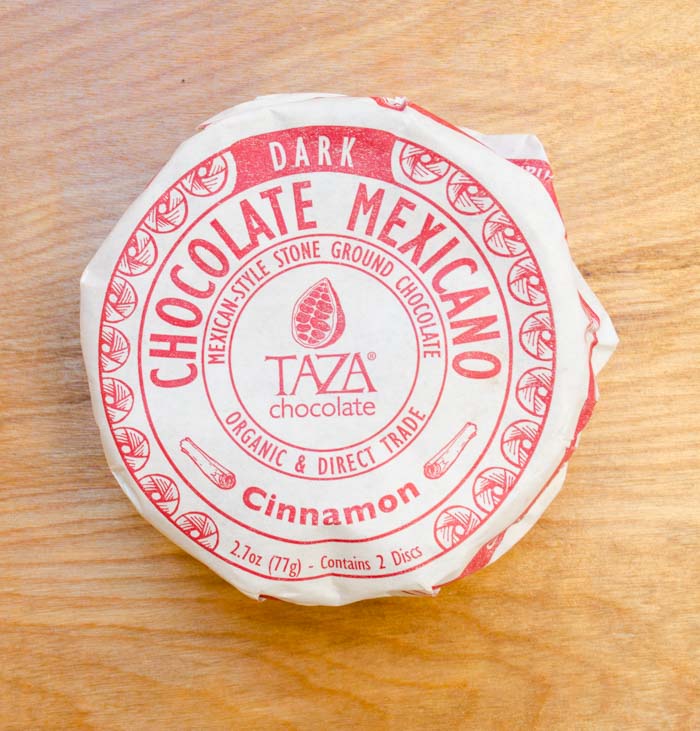 A wrapped circle of Taza Dark Cinnamon Mexican Chocolate.