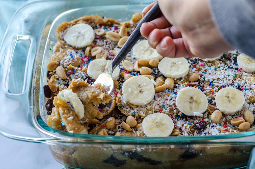 Vegan capirotada in a clear square baking dish.