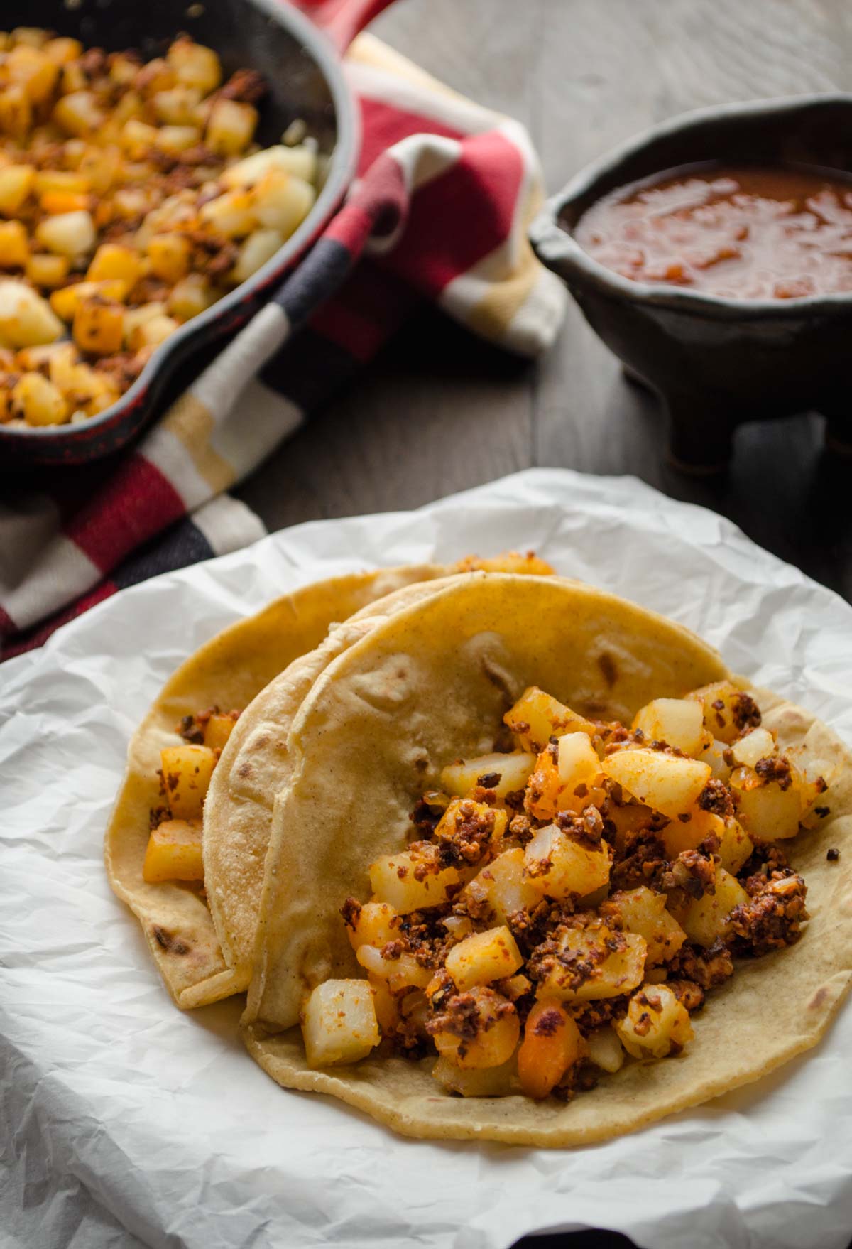 Potato and chorizo tacos. Serve the crispy bits of spicy chorizo mixed with the slightly golden potatoes on a warm tortilla and top with salsa.