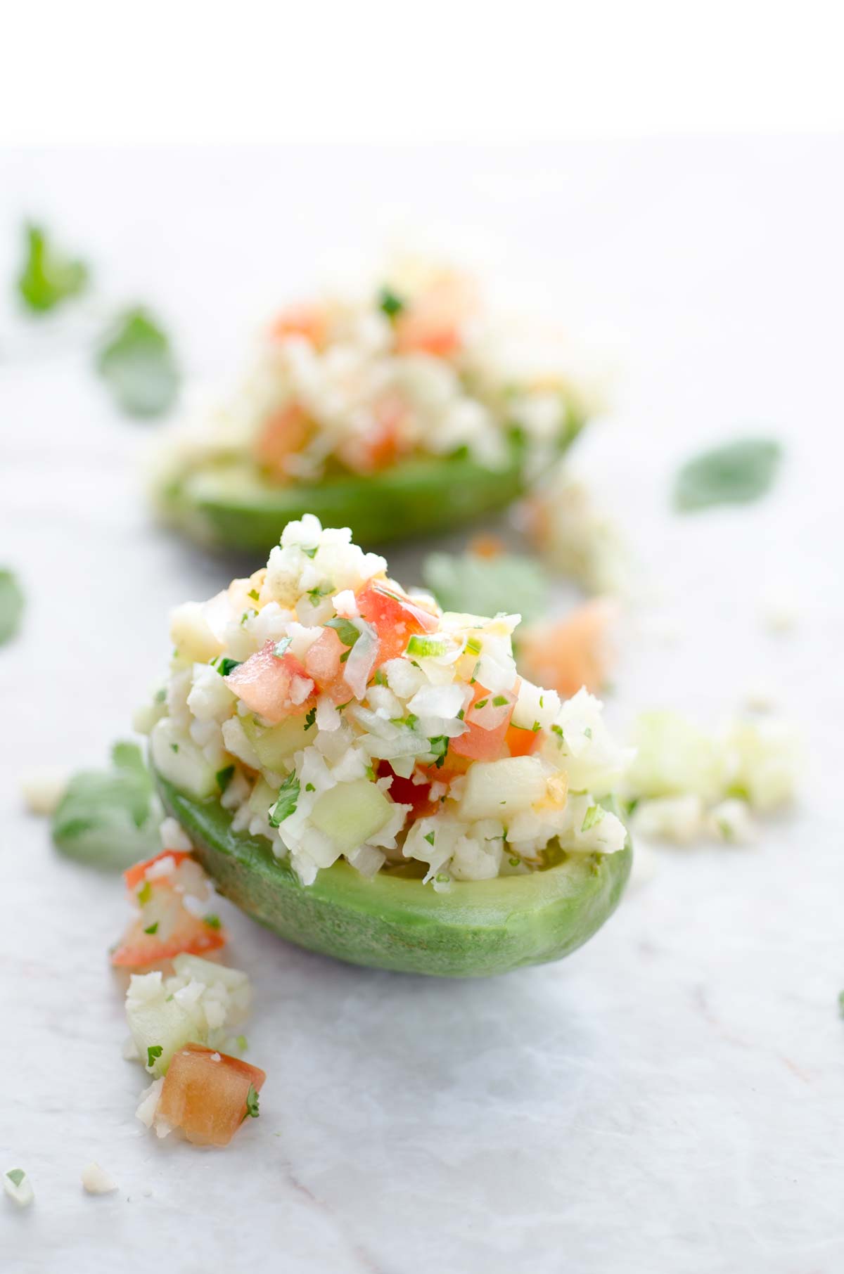 Avocado bowls filled with cauliflower ceviche.