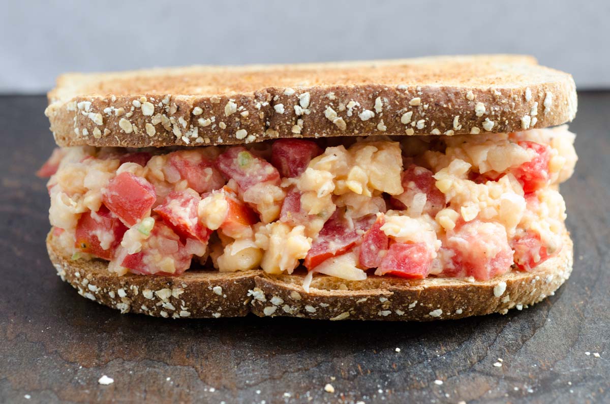 Mexican Vegan "Tuna" Salad between two toasted slices of multigrain bread.