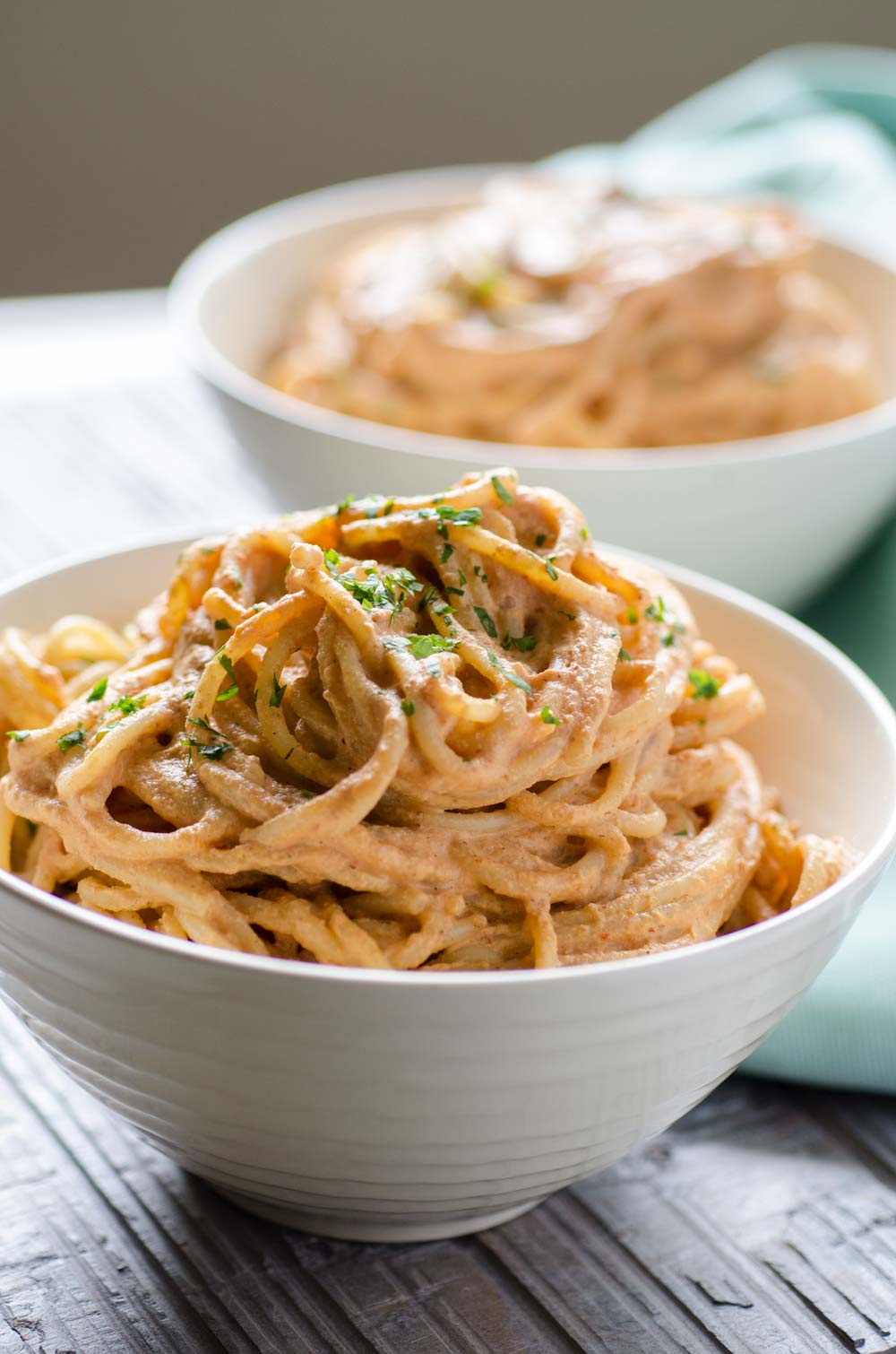 Creamy chipotle pasta in a small white bowl.