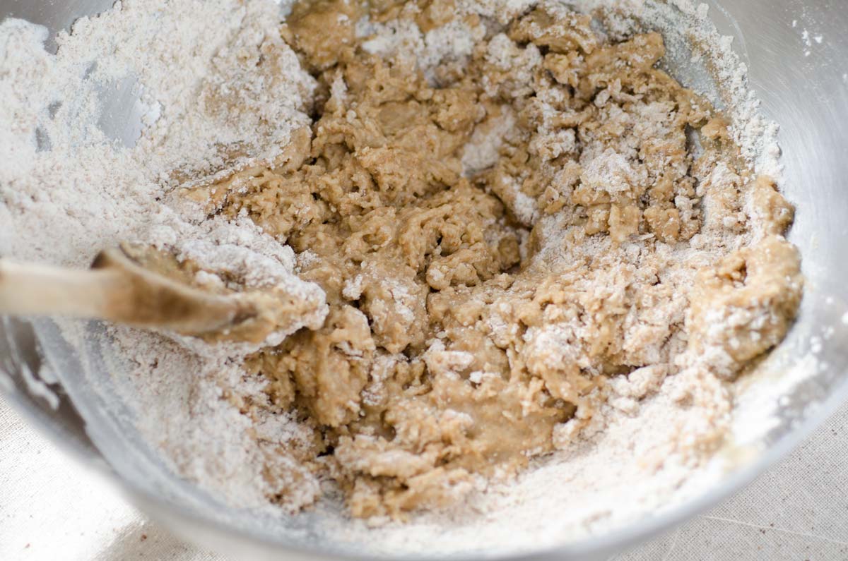 Dough mixed in a stainless steel bowl.