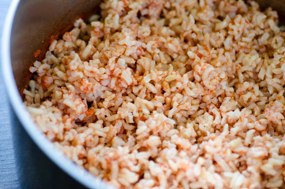 Cooked Mexican brown rice in a saucepan.