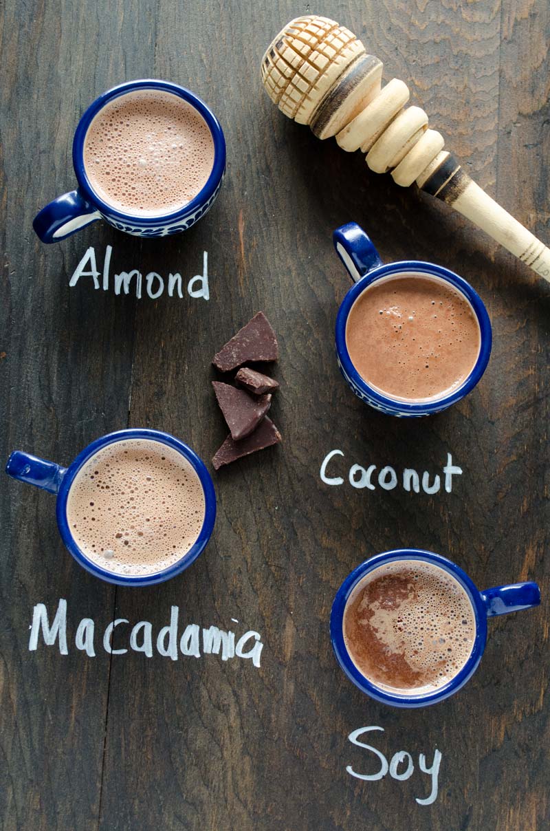 Mugs of Mexican hot chocolate made with various nondairy milks.