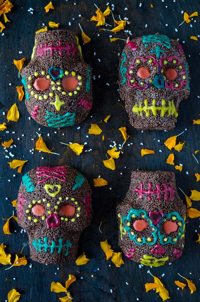 Chocolate amaranth sugar skulls decorated with colorful designs.