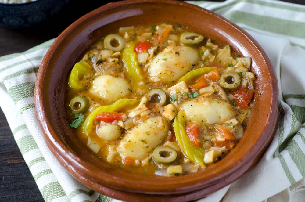 Top view of a brown bowl of Vegan Bacalao a la Vizcaína.