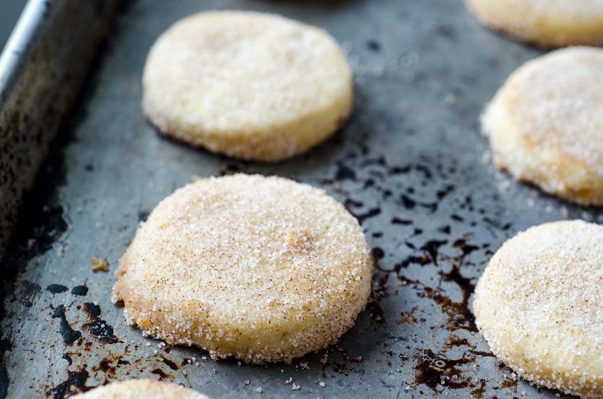 Vegan hojarascas shaped on a metal baking sheet.