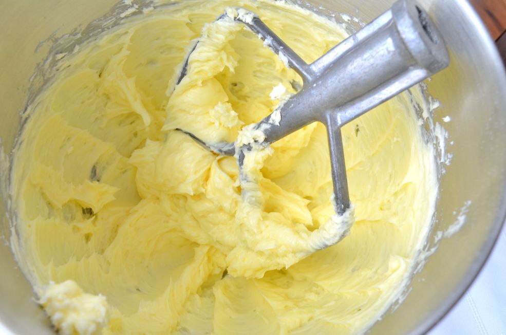 Polvorones dough in the metal bowl of a stand mixer.