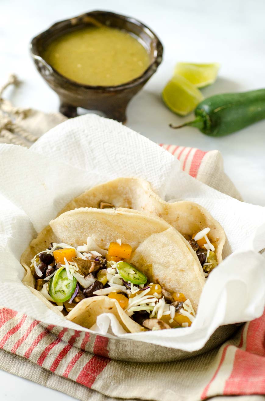 butternut squash and mushroom tacos with salsa verde, jalapeño and lime