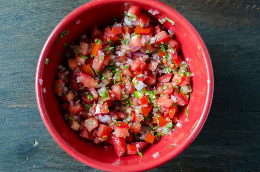 Pico de gallo in a red bowl for vegan fish tacos