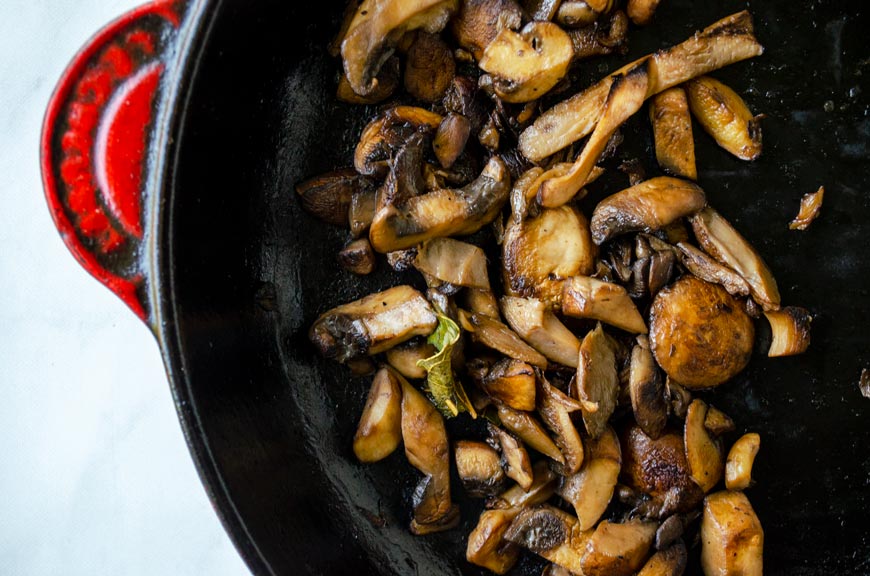 sauteed mushrooms in a cast iron pan