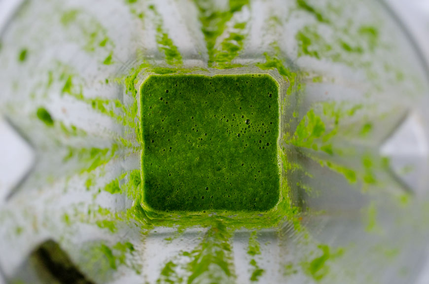 Green serrano-lime salsa in blender container.