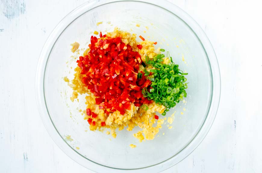 glass bowl chickpeas, diced red peppers, scallions