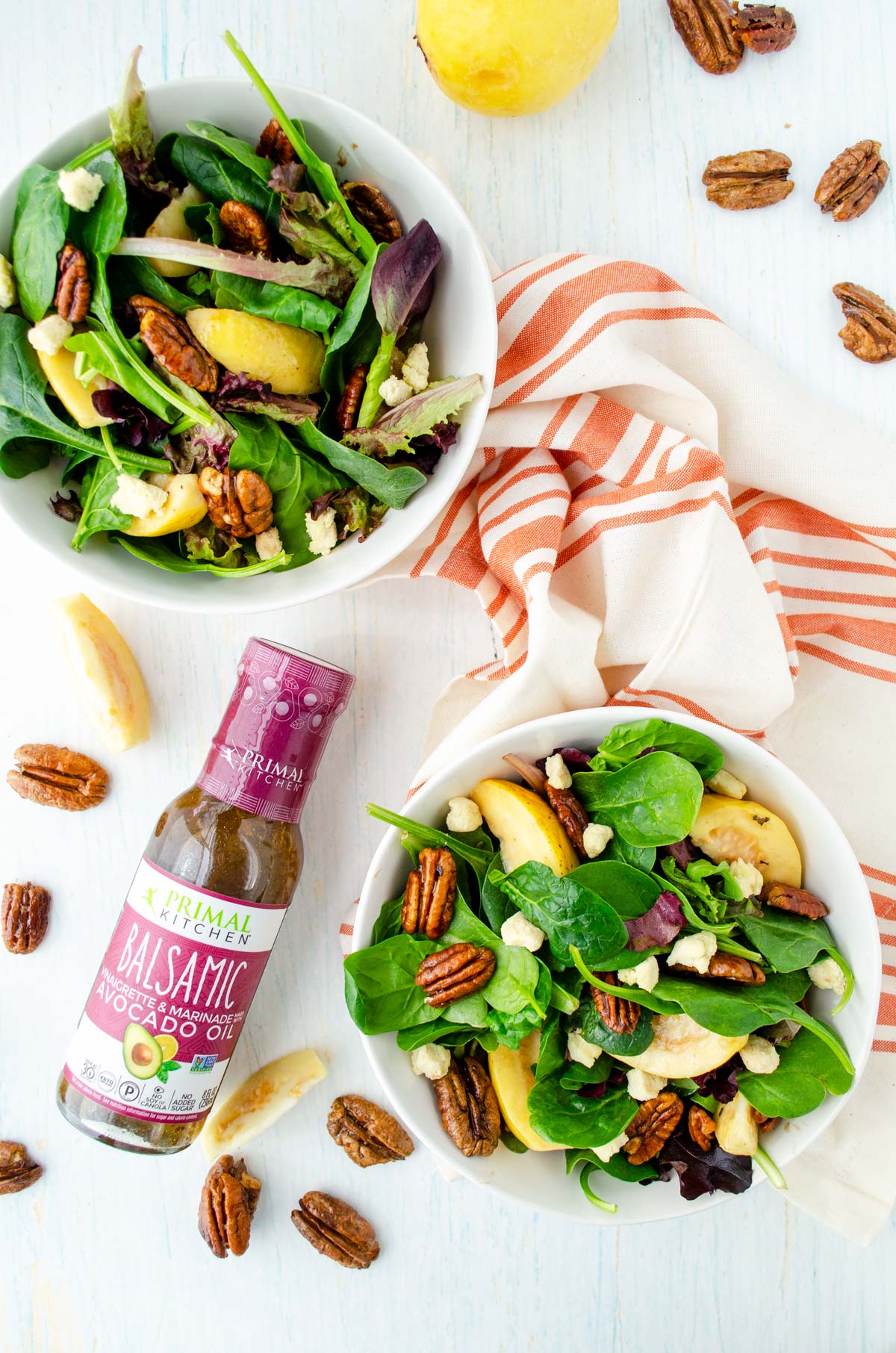 two bowl with guava salad and pecans on top of a red and white towel