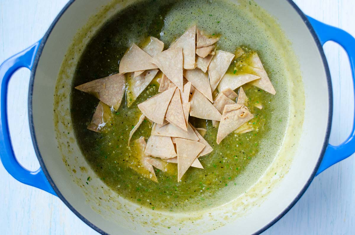 salsa verde and chips in a large enameled pot