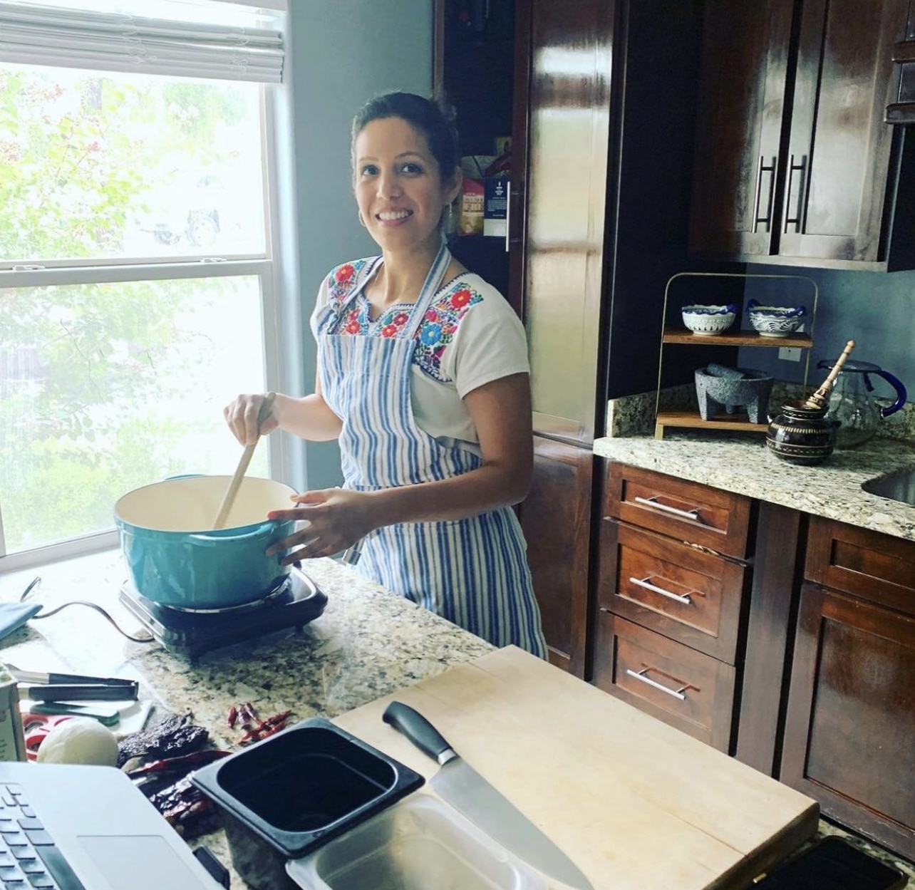 Chef Dora Stone giving a virtual vegan mexican cooking class in her kitchen