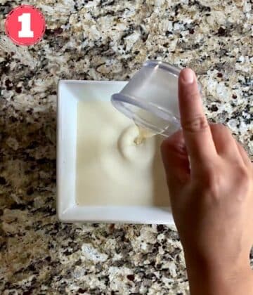 vinegar added to a bowl of soy milk