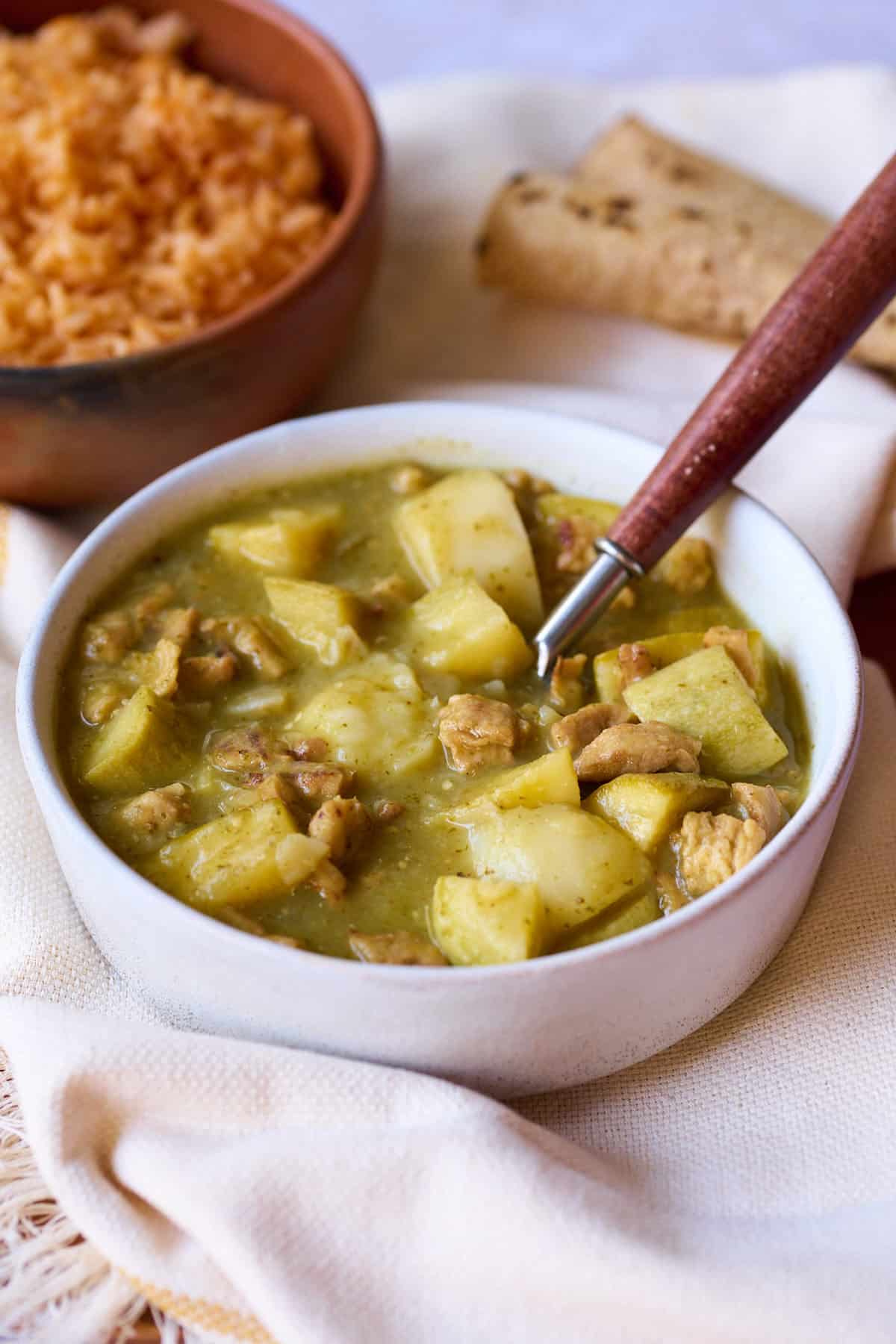 White bowl of soy curl chile verde.