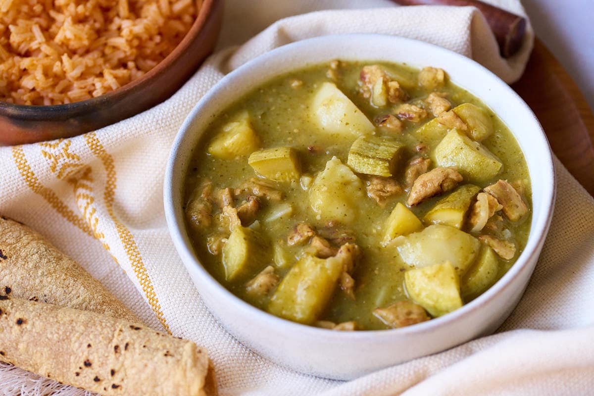 Vegan pork chile verde, tortillas, and Mexican rice.