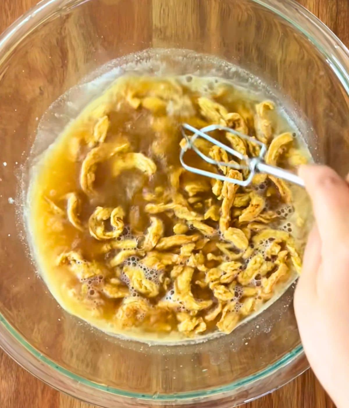 Soy curls marinating in a bowl.