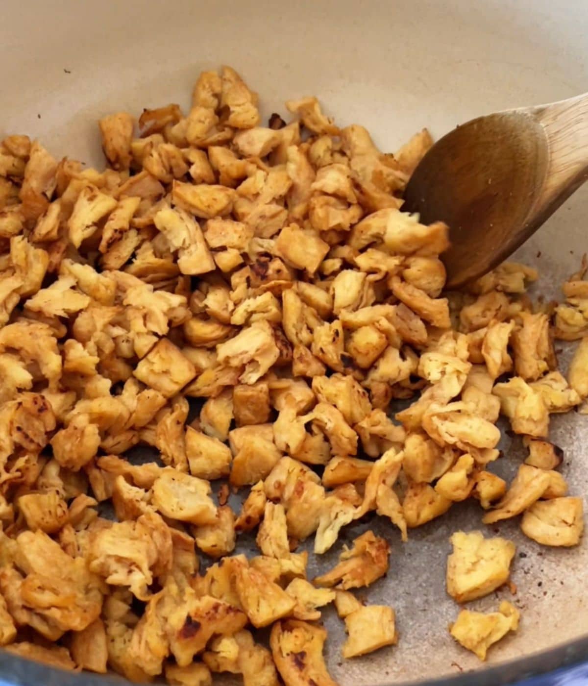 Soy curls cooking in a large pot.