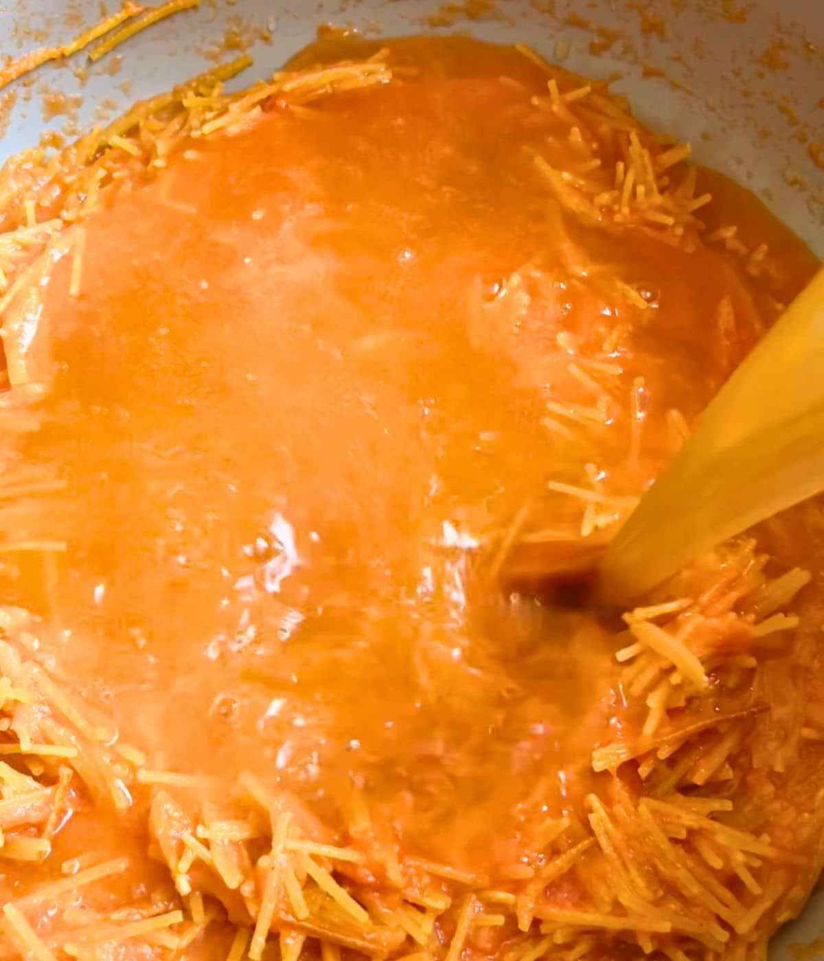 Broth added to the pot with the noodles.