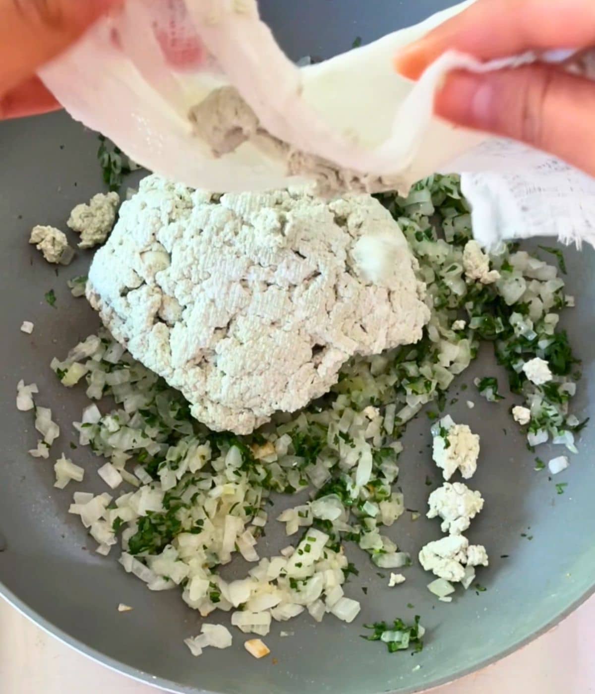 Pumpkin cheese added to skillet with onion and garlic.