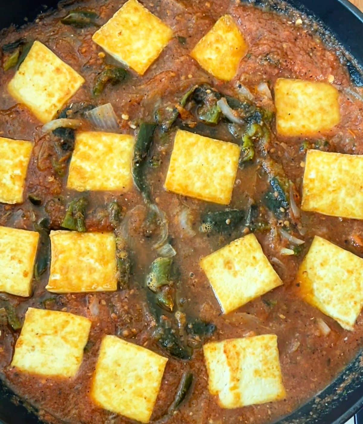 Tofu added to the skillet.